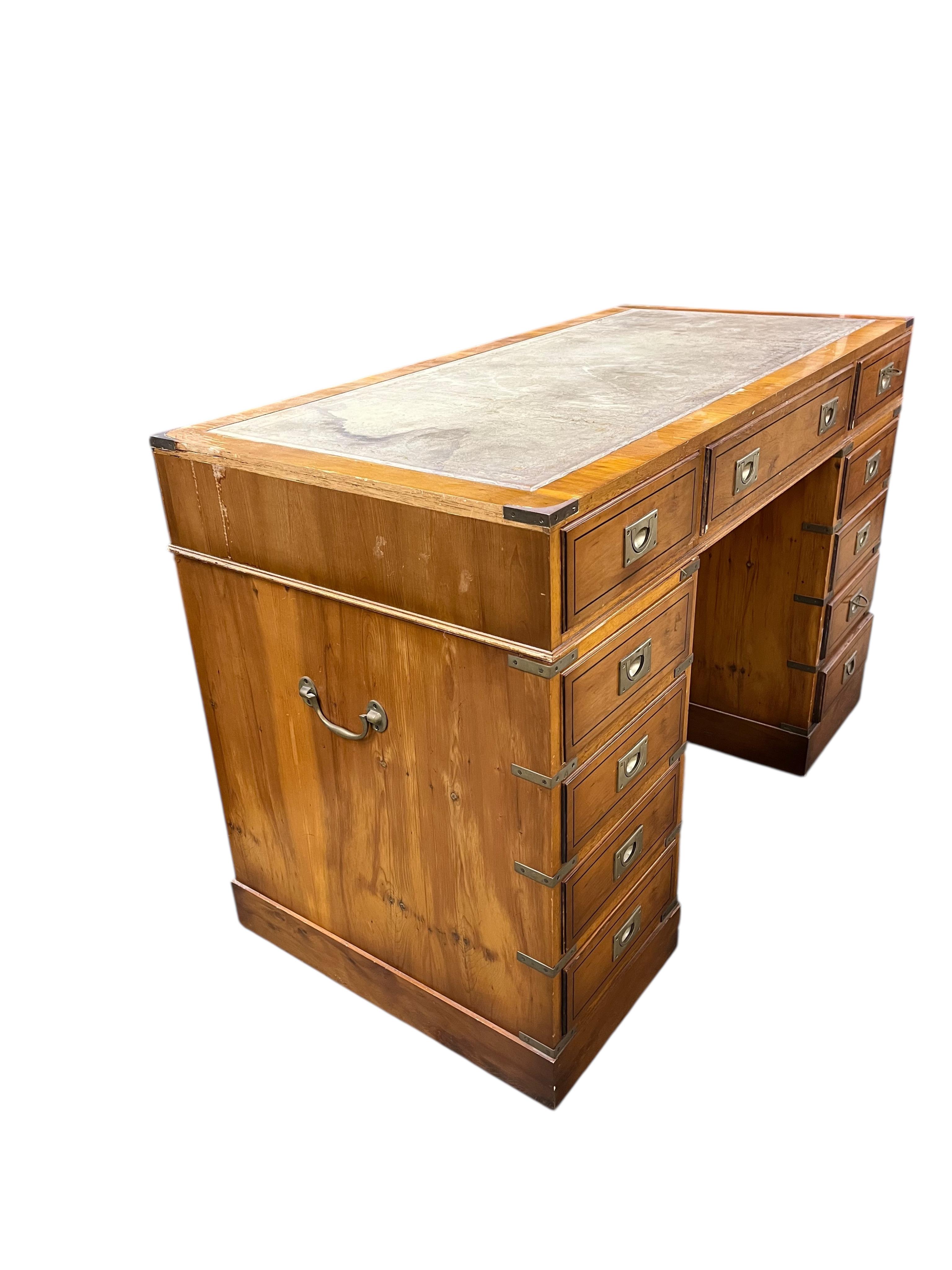 A reproduction yew military style pedestal desk, width 119cm, depth 58cm, height 79cm